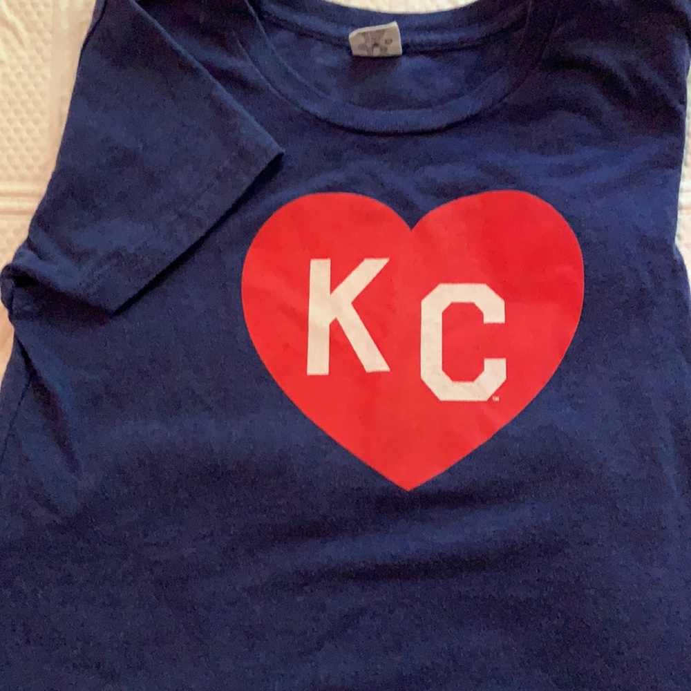 Blue tee shirt with a red heart around KC. Size 10